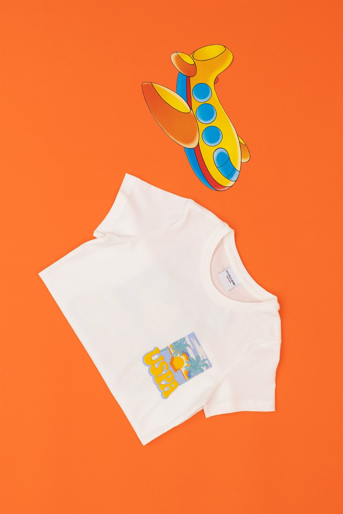 T-shirt USPA me print tropikal për djem