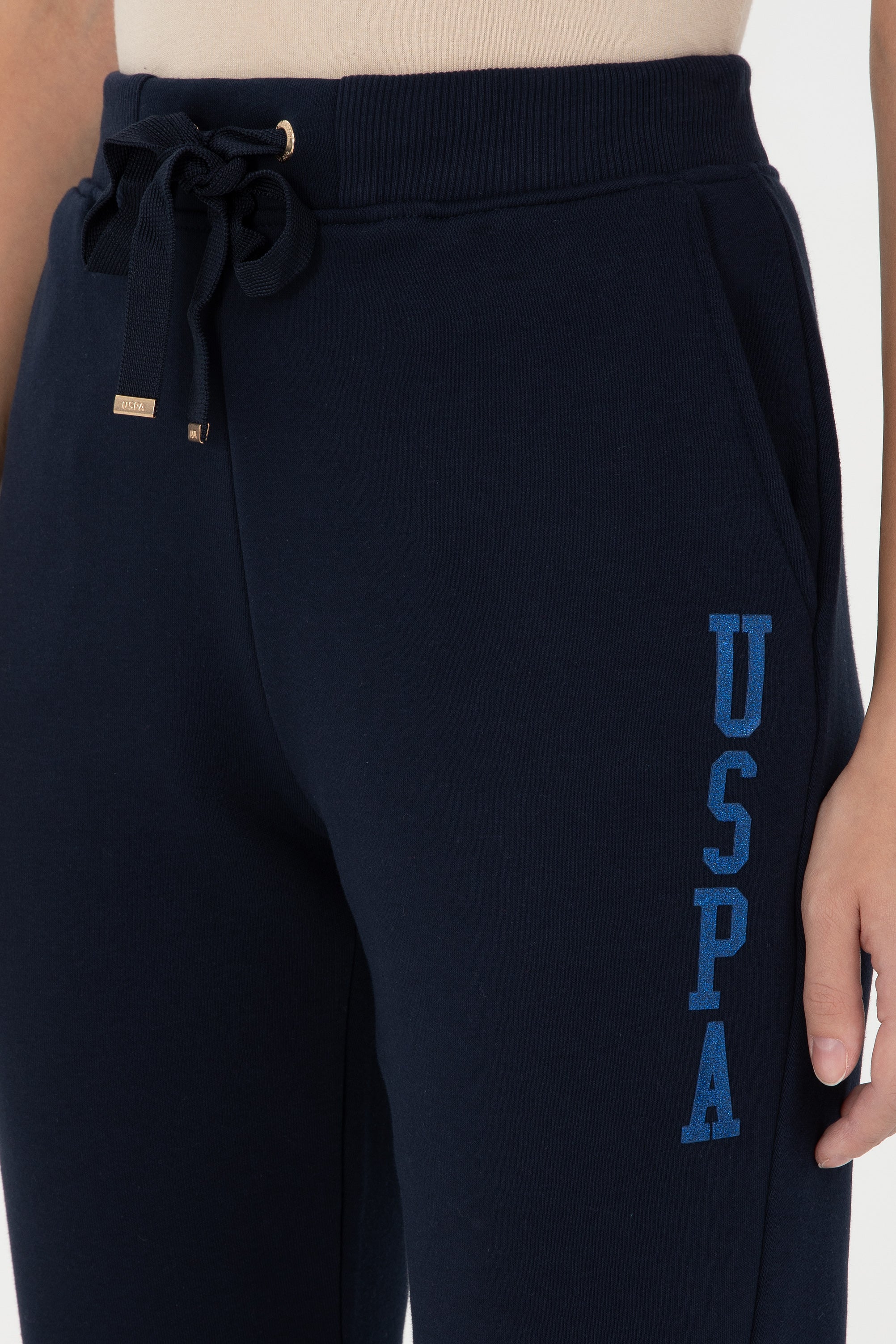 Tuta sportive me logo me shkëlqim